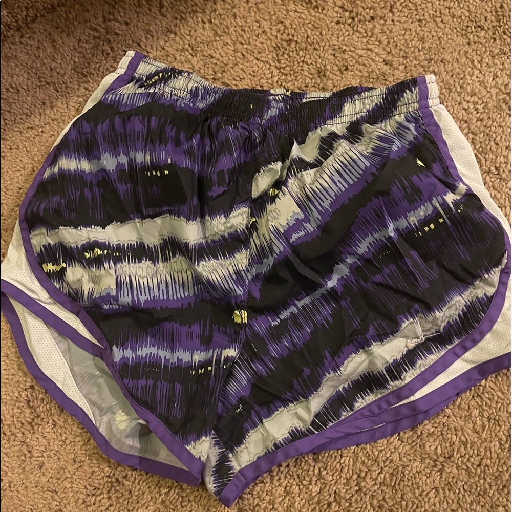 small purple dri fit nike running shorts